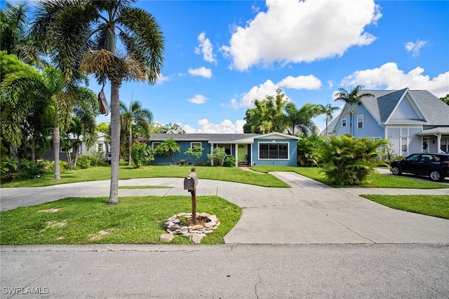 single story home with a front lawn