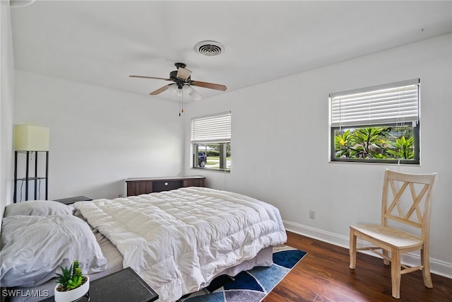 bedroom featuring dark wood-type flooring and ceiling fan