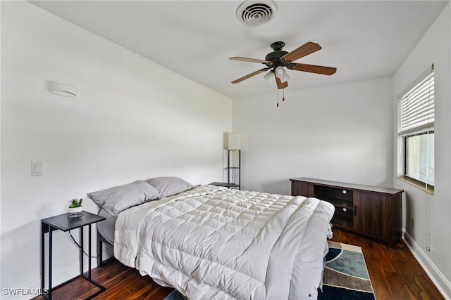 bedroom featuring ceiling fan and dark hardwood / wood-style floors