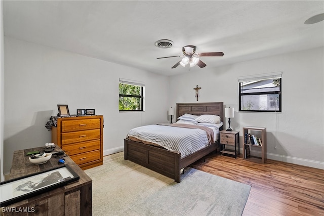 bedroom featuring ceiling fan and hardwood / wood-style flooring