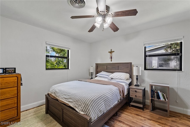 bedroom featuring ceiling fan and light hardwood / wood-style flooring