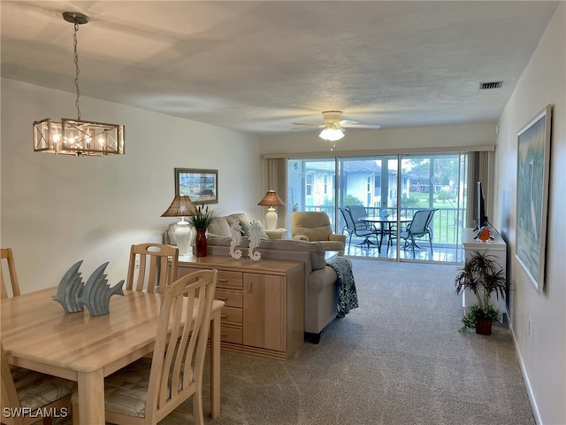 325 Charlemagne Blvd Unit B208, Naples, FL 34112 - carpeted dining area with a chandelier and ceiling fan