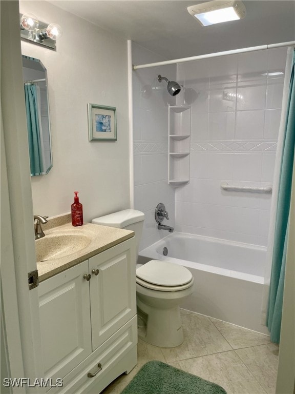 full bathroom featuring vanity, toilet, shower / bath combo with shower curtain, and tile patterned flooring