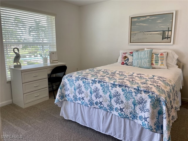 bedroom featuring light colored carpet