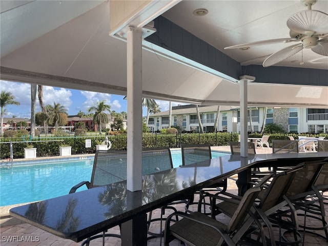 view of pool with a patio and ceiling fan