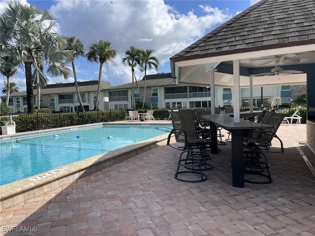 view of pool featuring a patio and ceiling fan