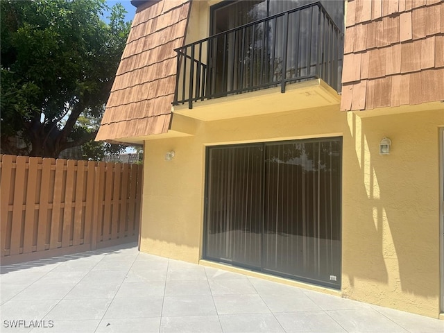 view of gate featuring a patio