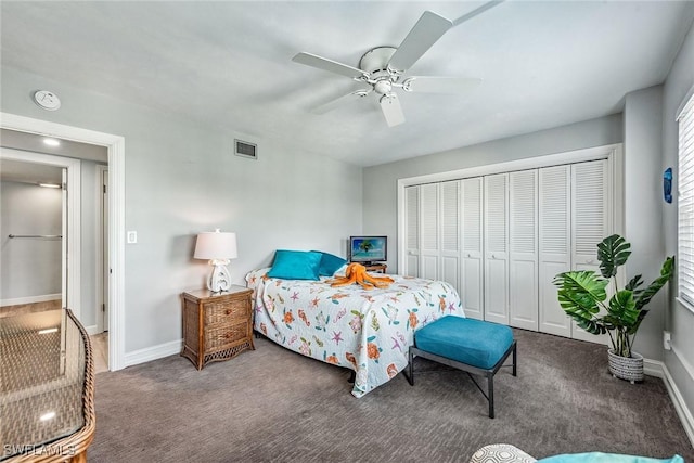 bedroom featuring a closet, ceiling fan, and dark colored carpet