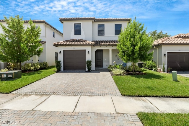 mediterranean / spanish house with a front yard