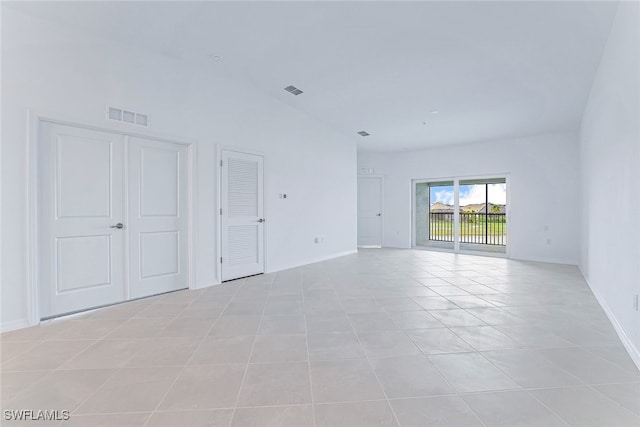 spare room featuring light tile patterned floors