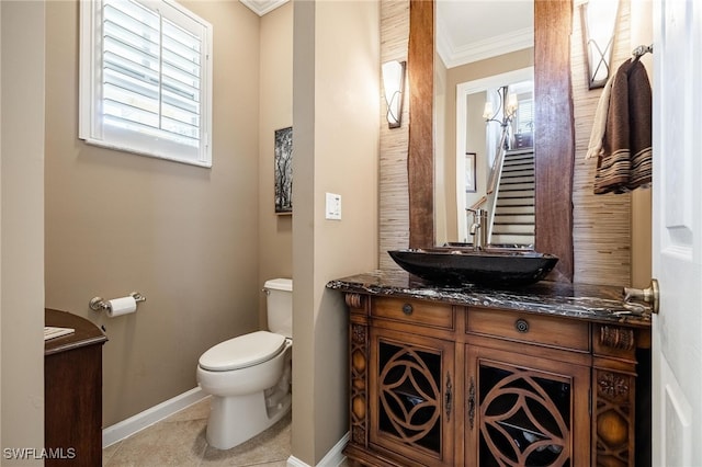 bathroom featuring ornamental molding, tile patterned flooring, vanity, and toilet