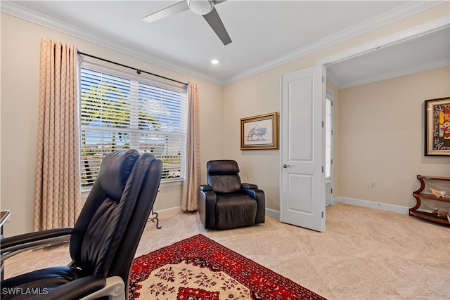 office space featuring light colored carpet, ceiling fan, and ornamental molding