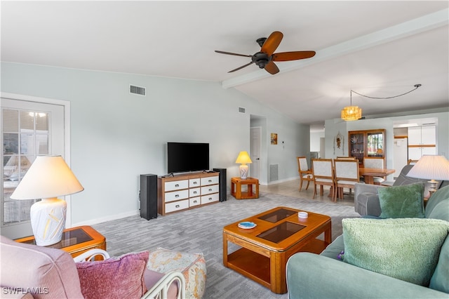 living room featuring lofted ceiling with beams, ceiling fan, and plenty of natural light