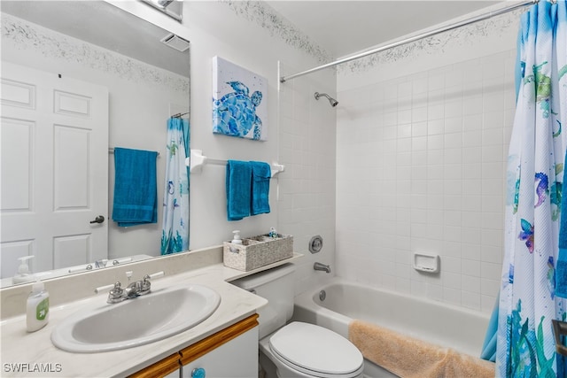 full bathroom with vanity, shower / tub combo, and toilet