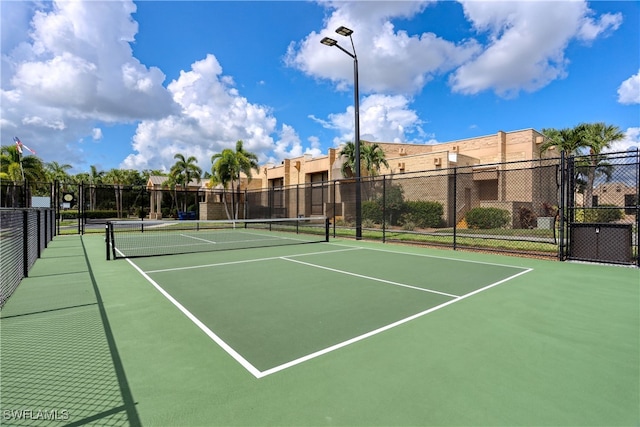 view of tennis court featuring basketball court