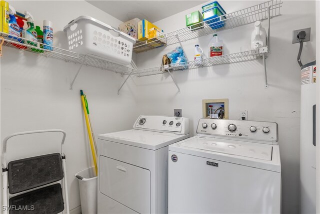 washroom with independent washer and dryer and electric water heater