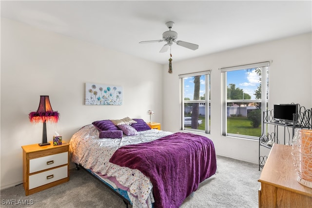 bedroom with ceiling fan and carpet floors