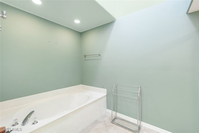 bathroom with tile patterned flooring and a bathing tub