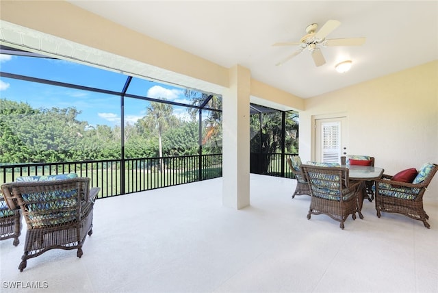 sunroom / solarium featuring ceiling fan