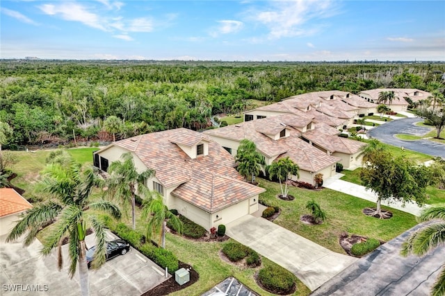 bird's eye view featuring a wooded view