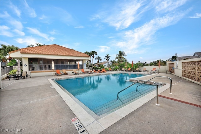 view of swimming pool with a patio