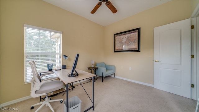 office with a ceiling fan, light colored carpet, and baseboards