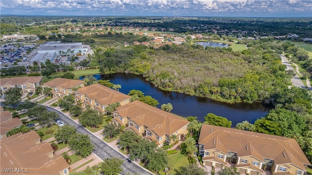 drone / aerial view featuring a residential view and a water view