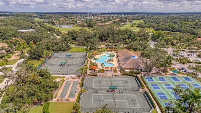 birds eye view of property featuring view of golf course and a water view