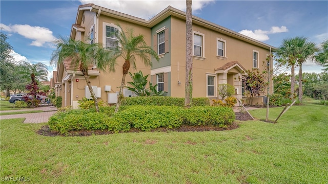 view of home's exterior with a lawn