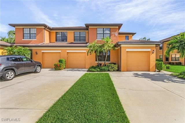 view of front facade featuring a garage and a front yard