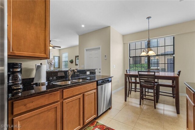 kitchen with pendant lighting, dishwasher, ceiling fan, and a wealth of natural light