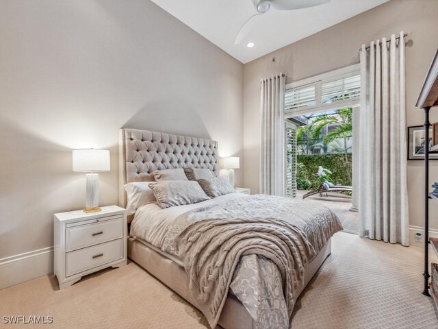 bedroom with light carpet, lofted ceiling, and ceiling fan