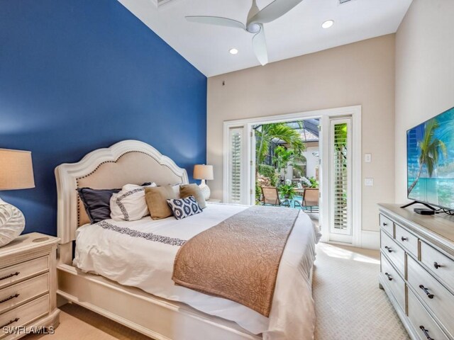 carpeted bedroom with ceiling fan and access to outside