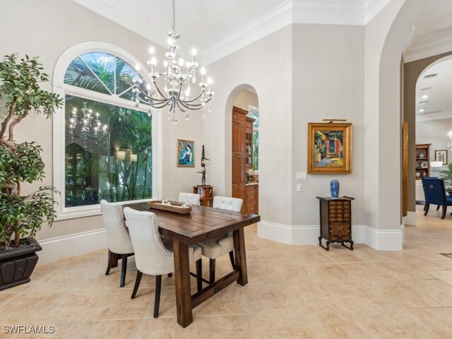 dining area featuring light tile patterned floors, a chandelier, crown molding, and a towering ceiling