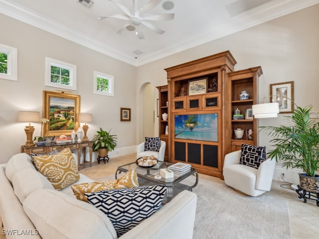 living room with ornamental molding and ceiling fan