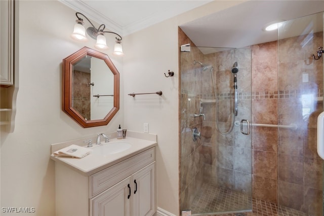 bathroom with vanity, crown molding, and walk in shower