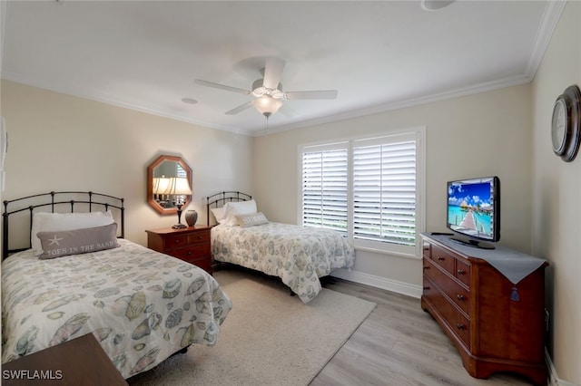 bedroom featuring light hardwood / wood-style flooring, ornamental molding, and ceiling fan