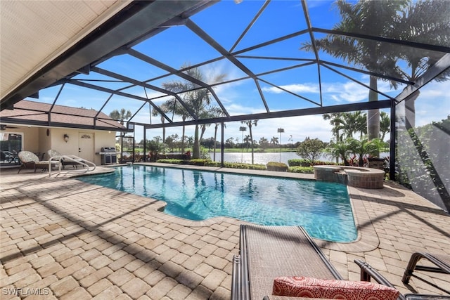 view of swimming pool featuring an in ground hot tub, a lanai, a grill, and a patio