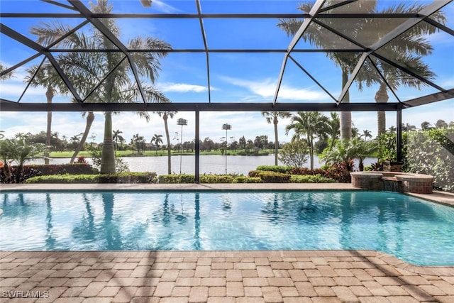 view of pool featuring a lanai, a patio, and a water view