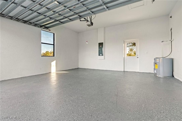 garage with water heater, a garage door opener, and electric panel