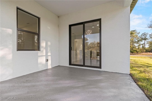 property entrance with a patio area