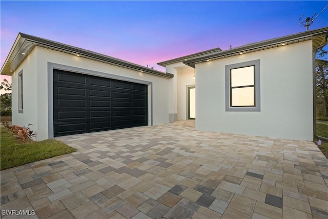 view of front of property featuring a garage