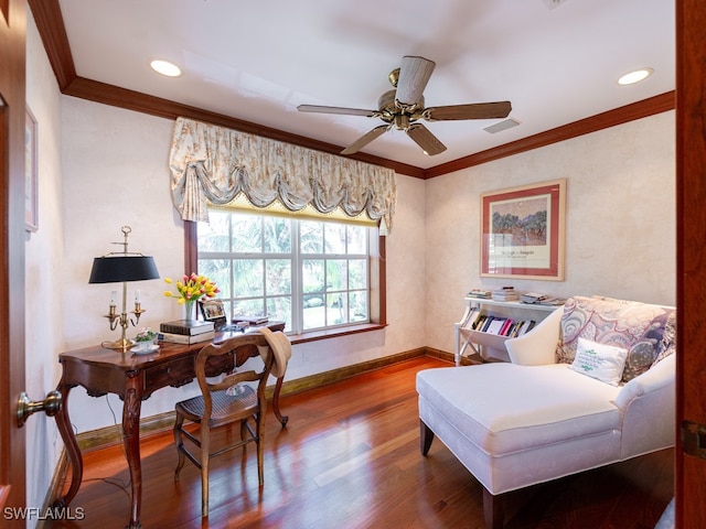 living area with hardwood / wood-style flooring, ceiling fan, and crown molding