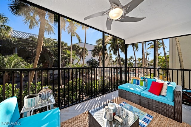 sunroom / solarium with plenty of natural light and ceiling fan