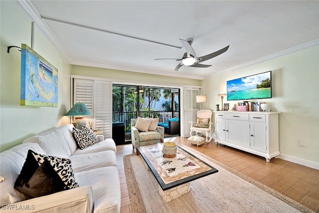 living room with light wood-type flooring, ceiling fan, and ornamental molding