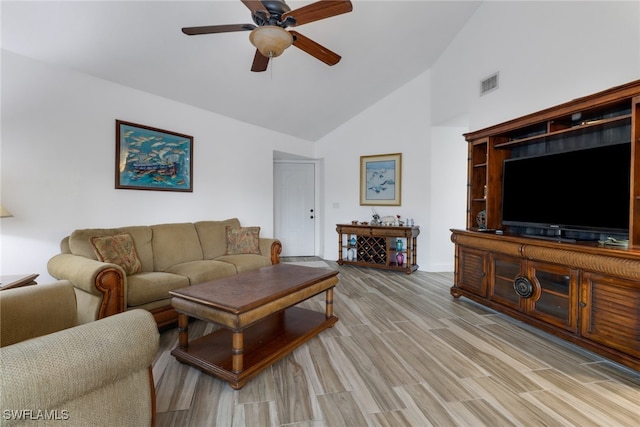 living room with high vaulted ceiling, light hardwood / wood-style floors, and ceiling fan