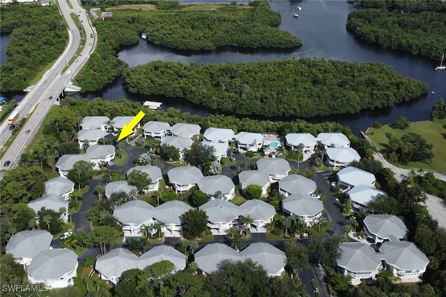 birds eye view of property with a water view