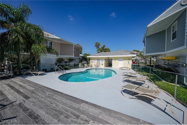 view of swimming pool featuring a patio area