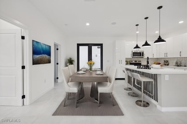 dining area featuring recessed lighting, baseboards, and french doors