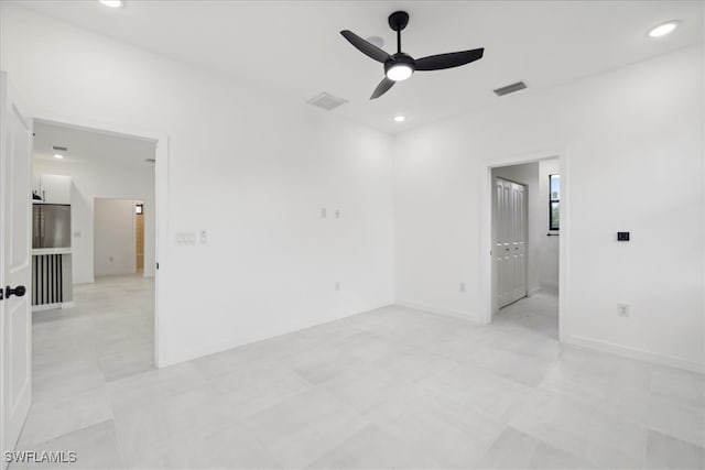 unfurnished room with ceiling fan